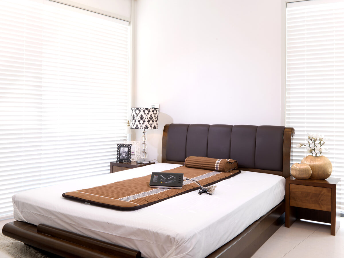 Woman practicing wellness with Biomat in serene setting